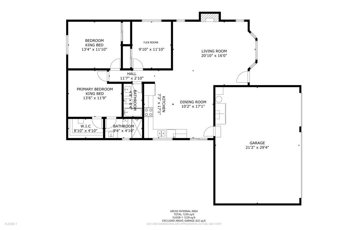 A welcoming, open-plan view reveals the home's living room, dining area, kitchen, and a glimpse into the primary bedroom. The atmosphere is inviting and versatile, ideal for gatherings or relaxing after a day out.